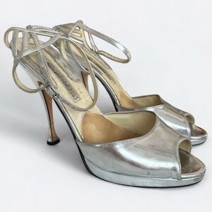 Brian Atwood silver metallic high heel platform evening sandal.